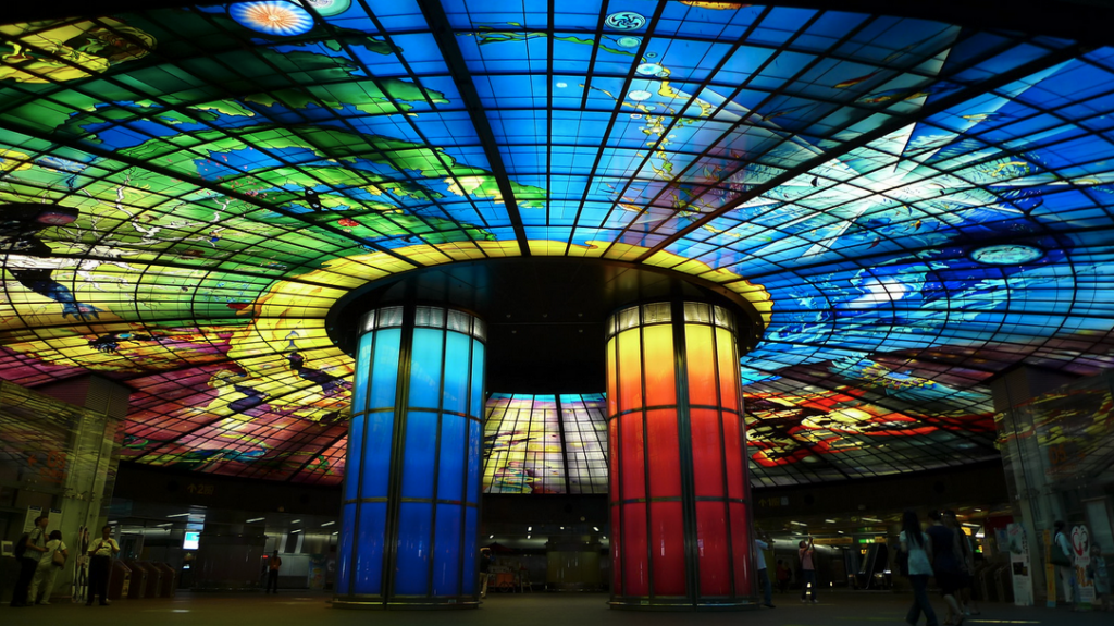 a colorful glass ceiling with columns