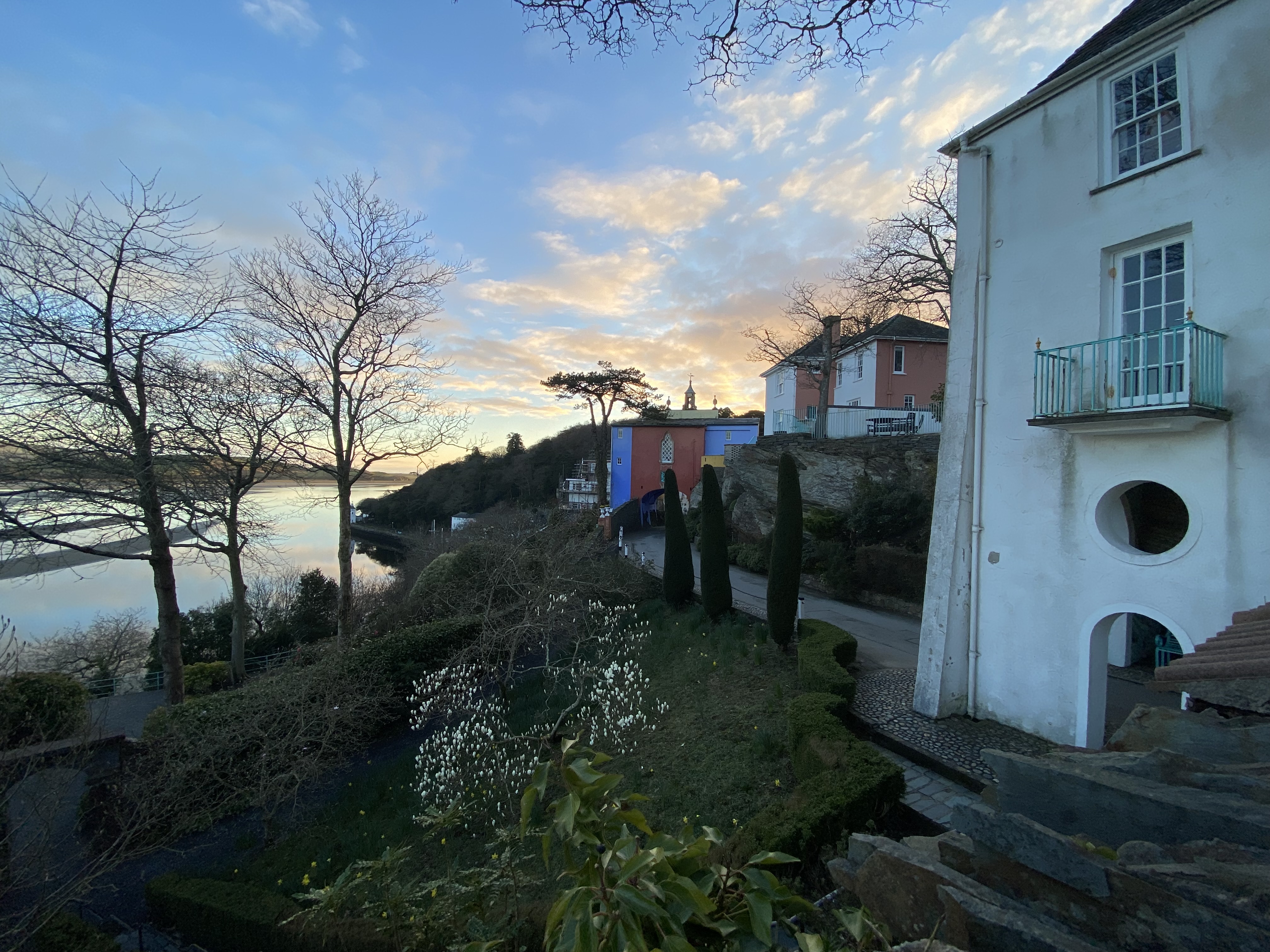 a group of buildings next to a body of water