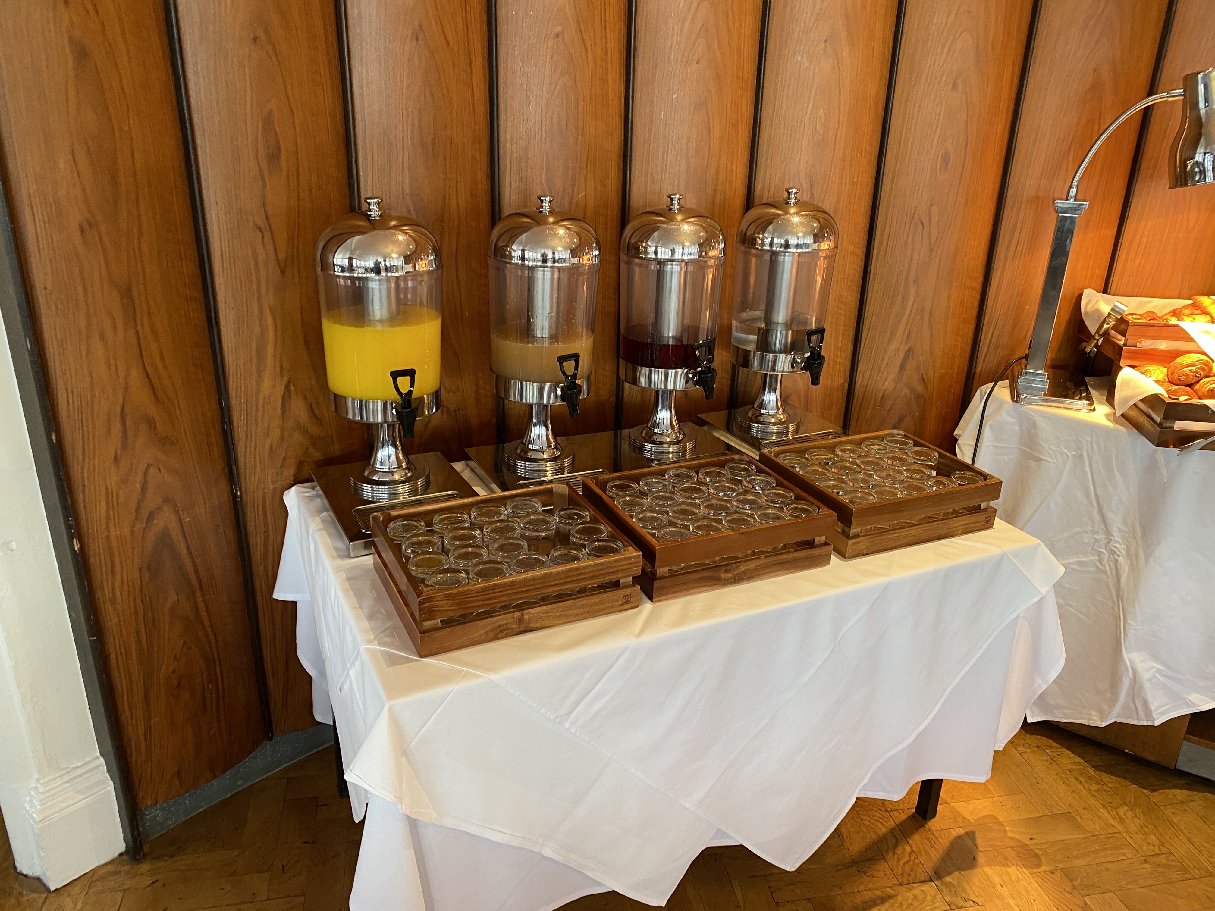 a table with a group of drinks dispensers