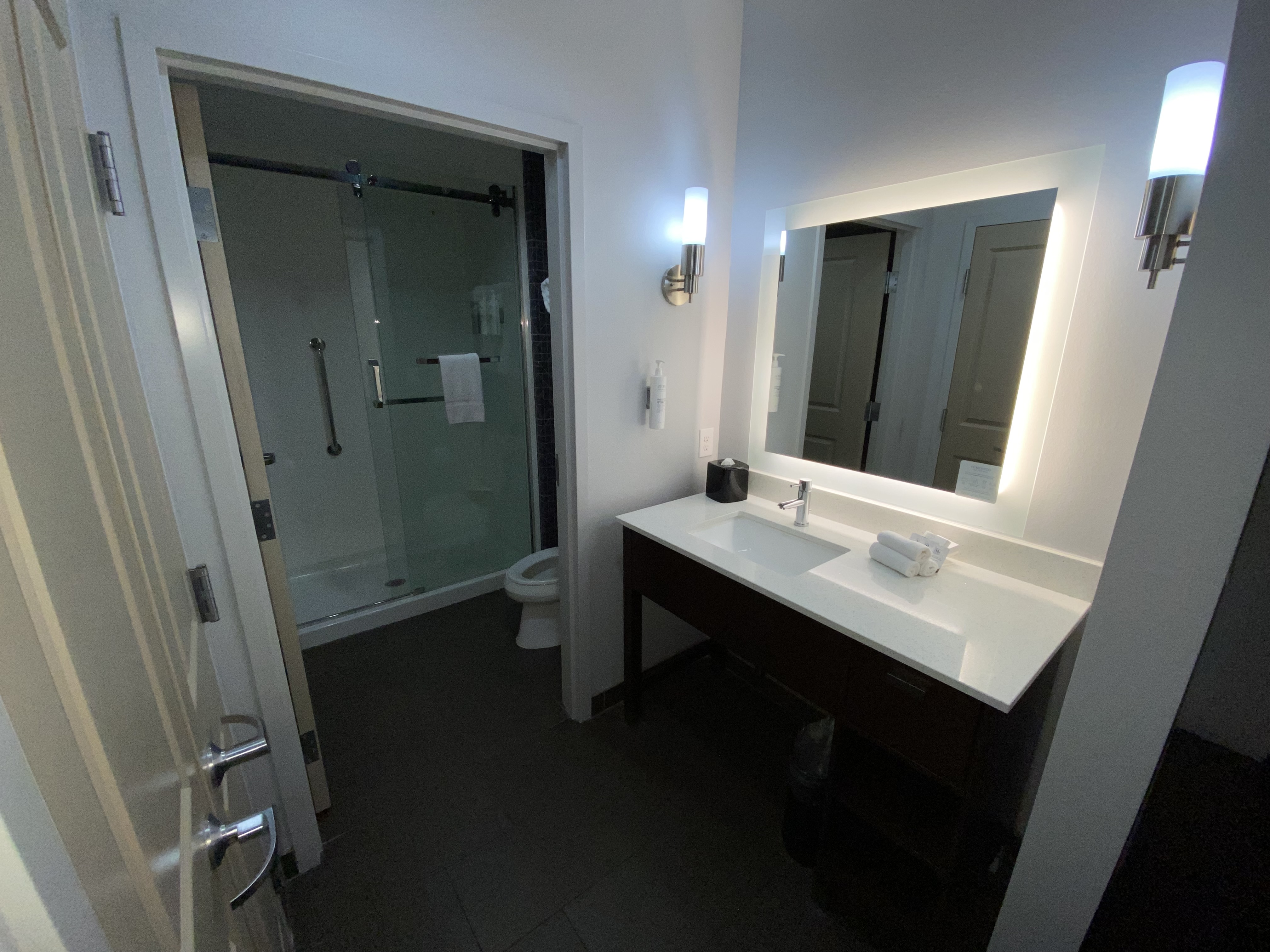 a bathroom with a mirror and a sink