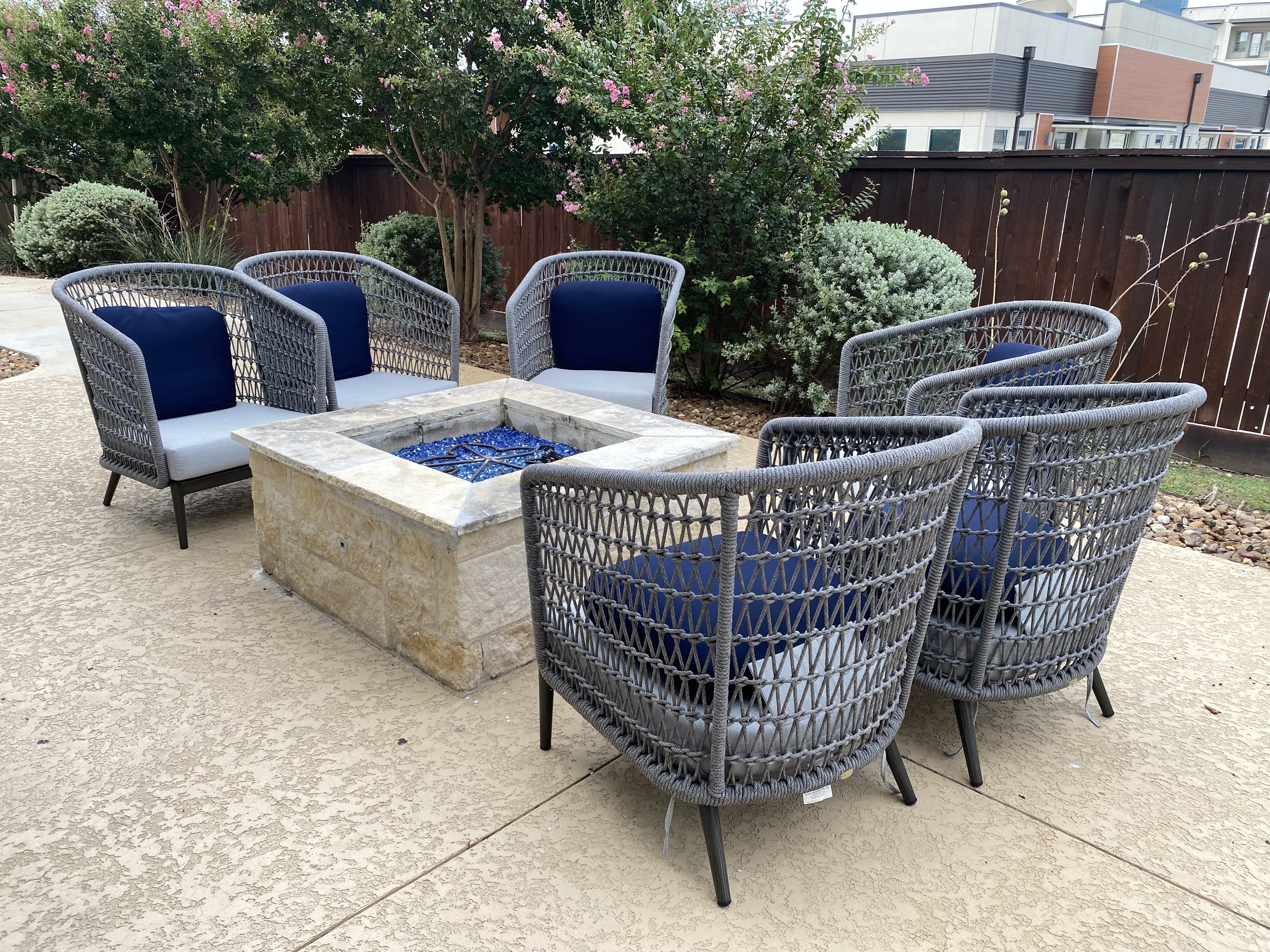 a group of chairs and a fire pit