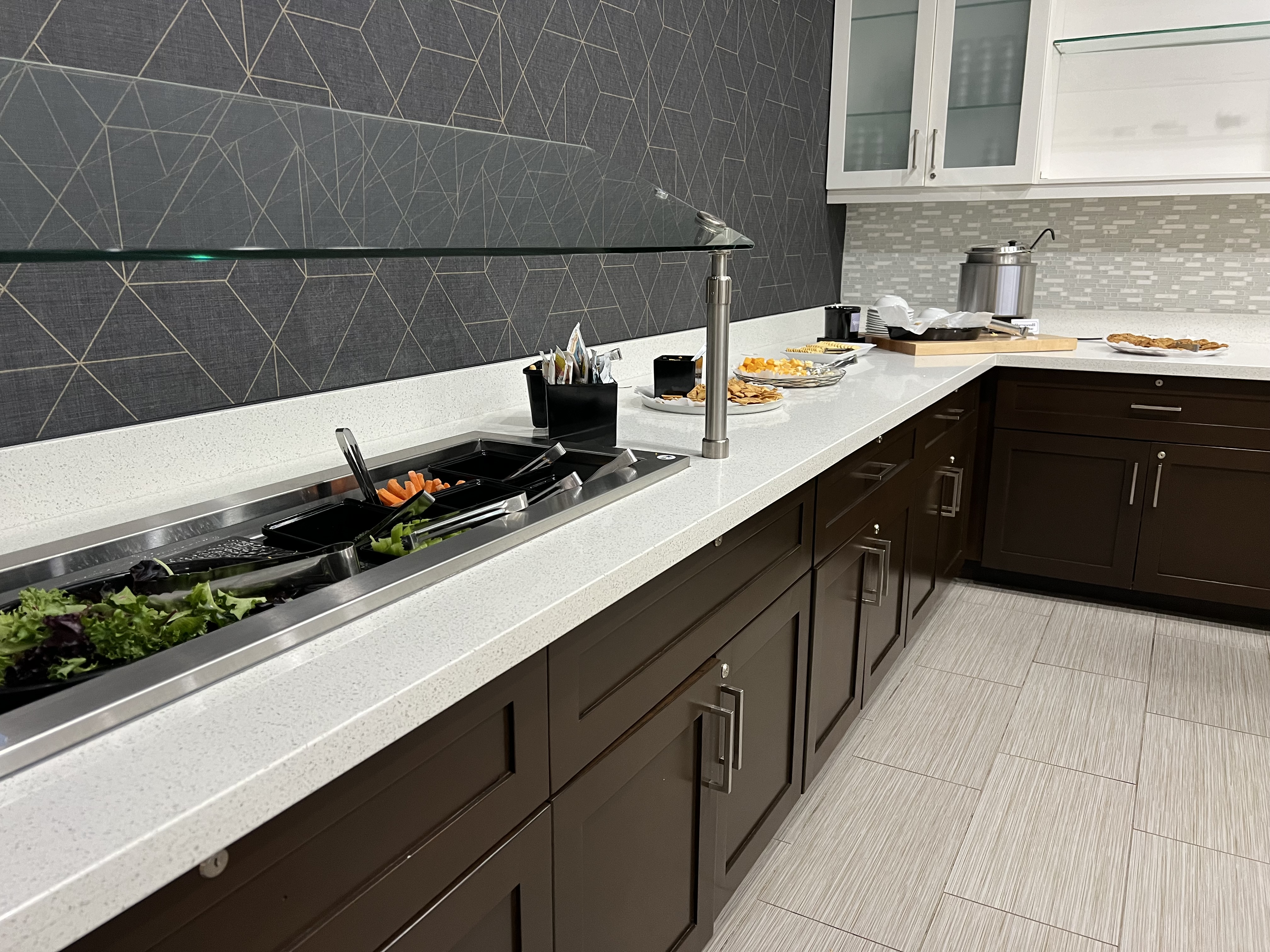 a kitchen with a sink and food on it