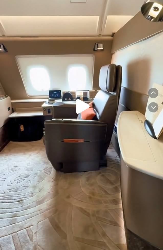 a person in a chair in a plane