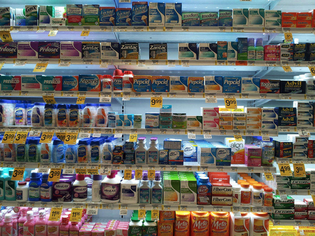 shelves of medicine on shelves with price tags