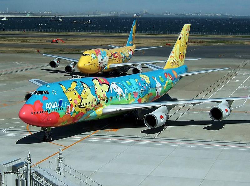 a group of airplanes on a runway