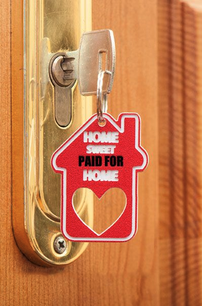 a keychain with a heart shaped keyring attached to a door