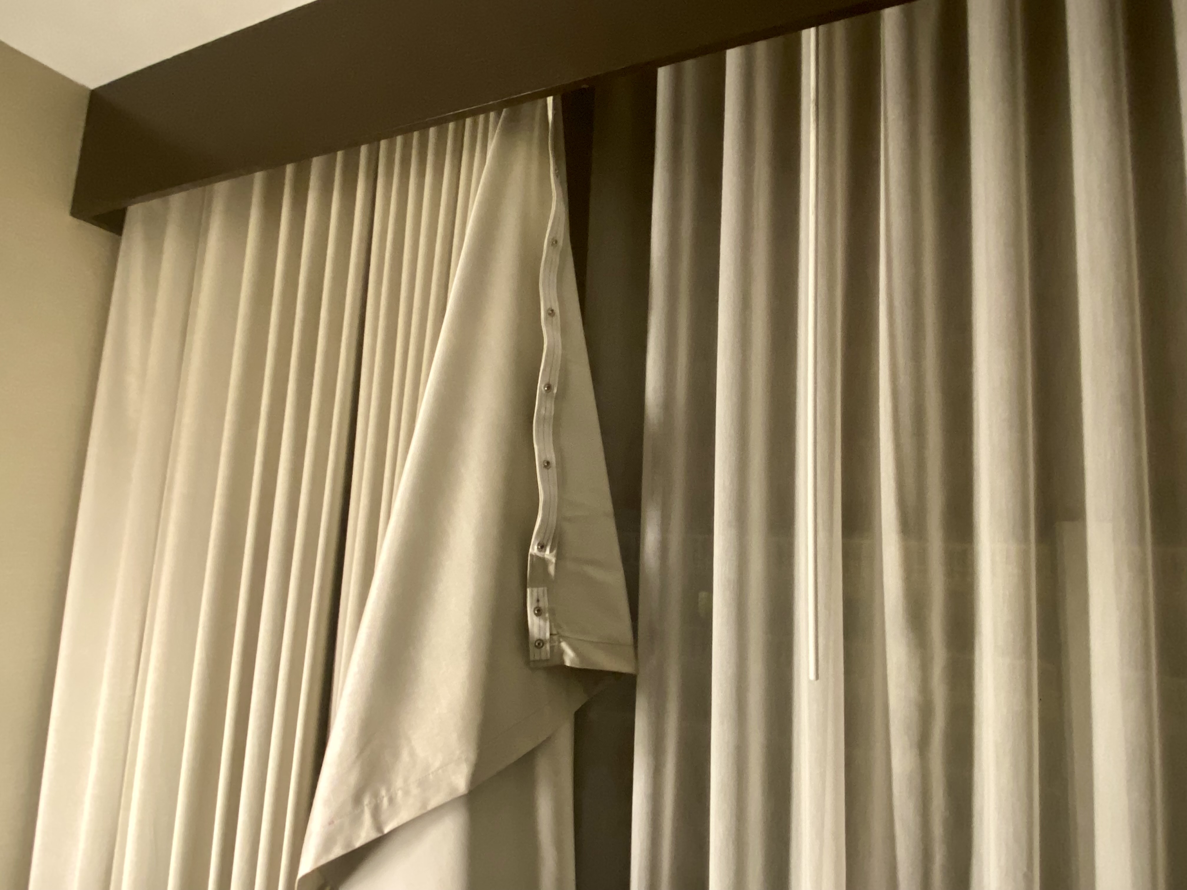 a curtain with a strap from it