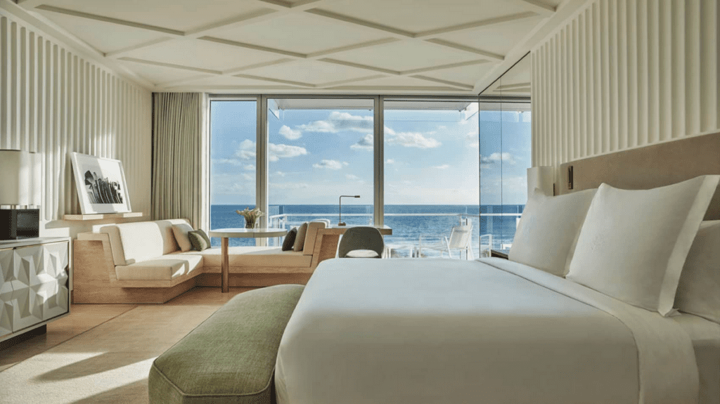 a room with a large window overlooking the ocean