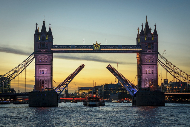 a bridge with a bridge open to the water