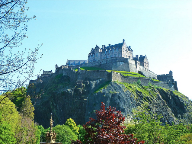 a castle on a hill with Edinburgh Castle in the background