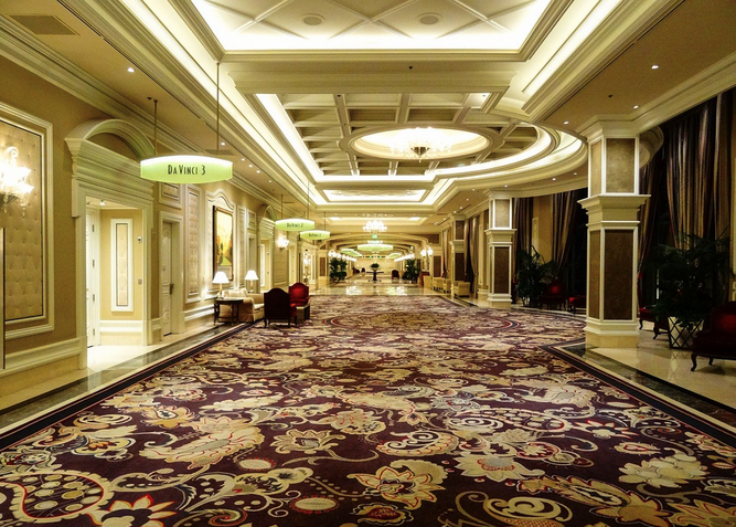 a hallway with a carpeted floor