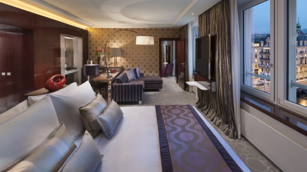 a room with a bed and a television