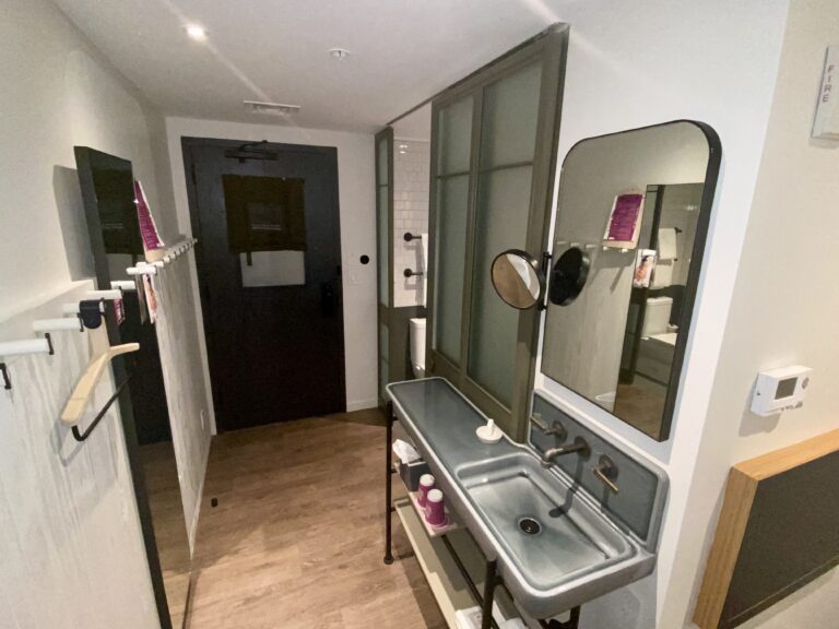 a bathroom with a mirror and sink