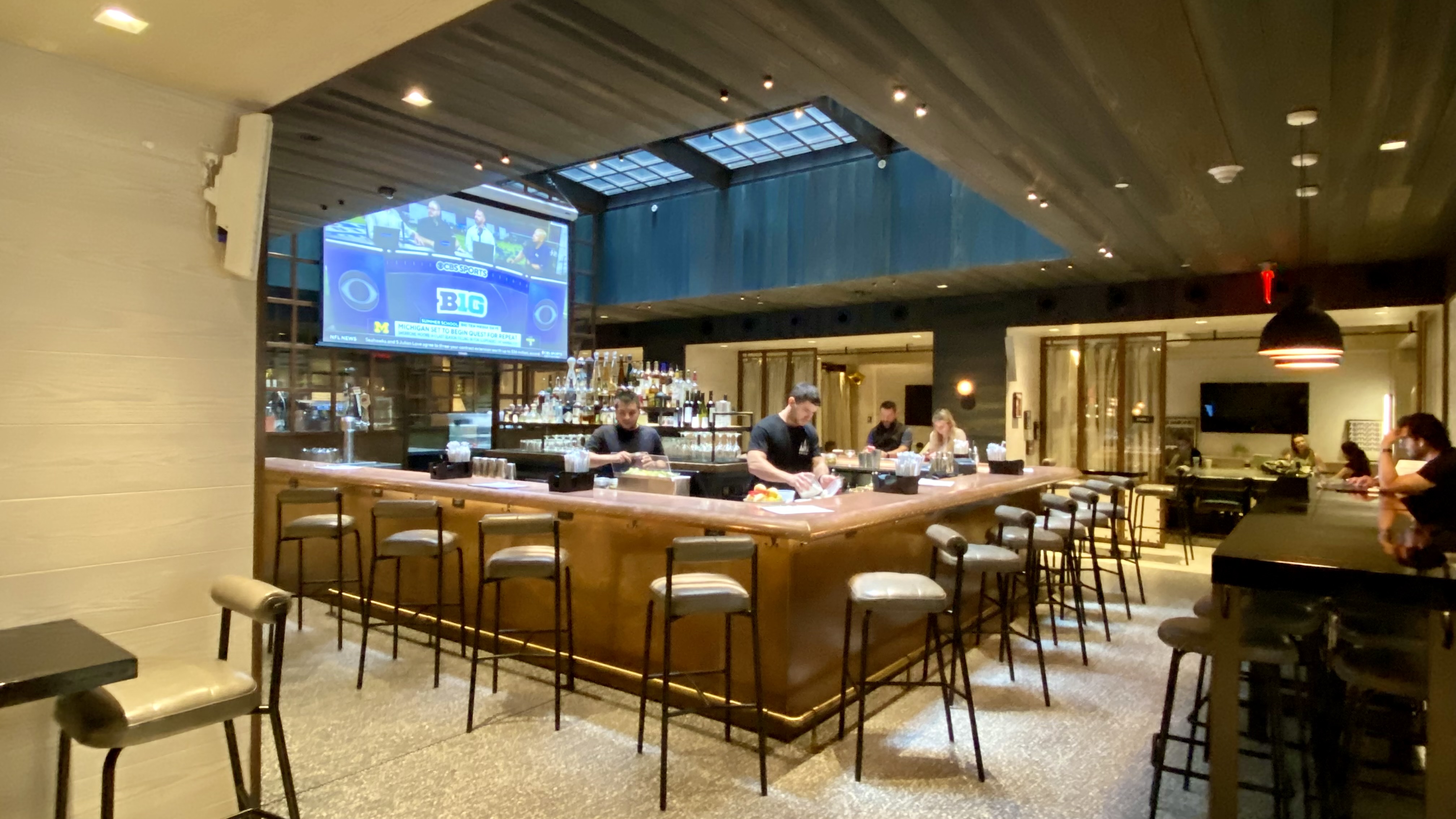 a group of people sitting at a bar