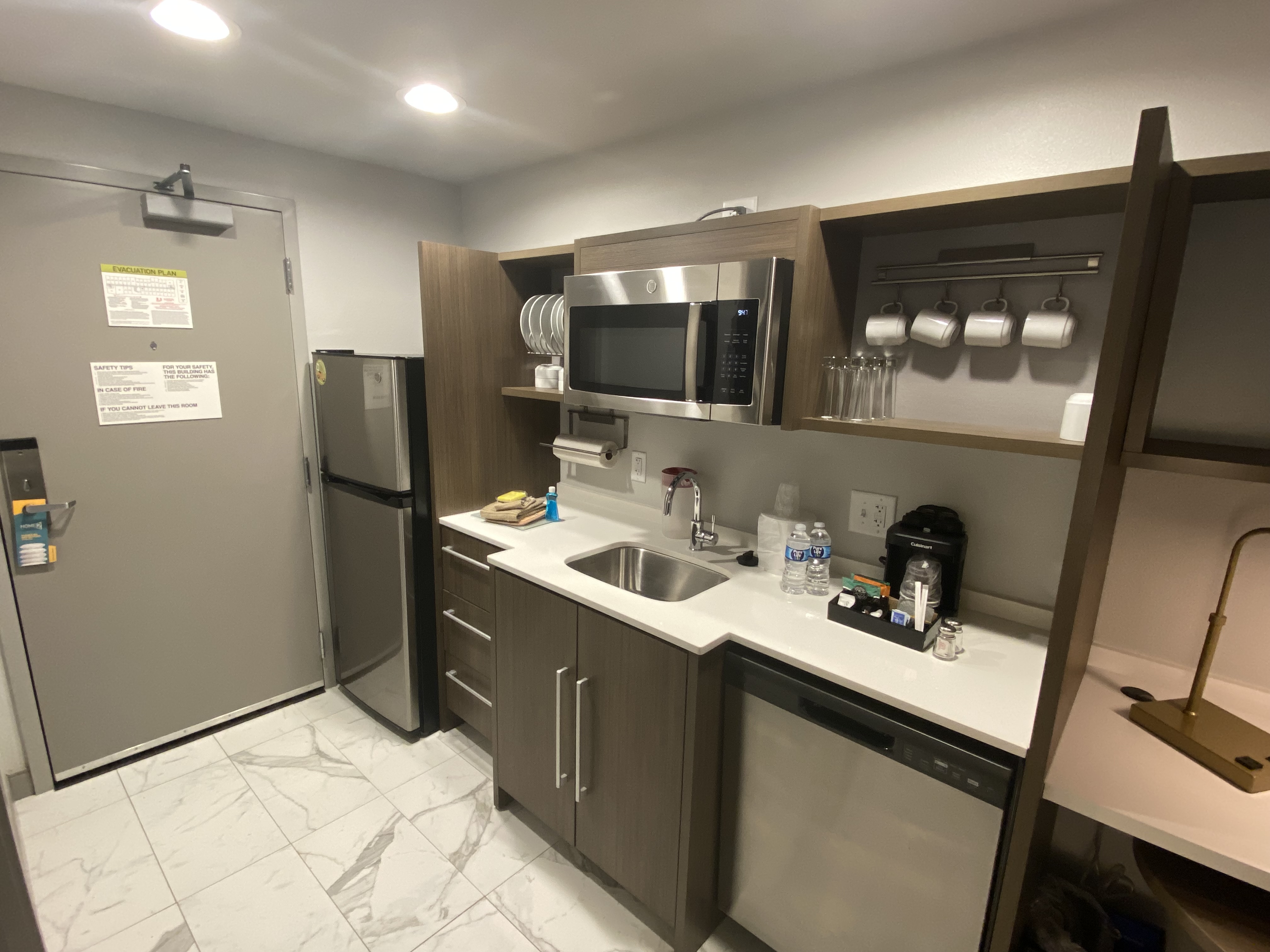 a kitchen with a sink and microwave