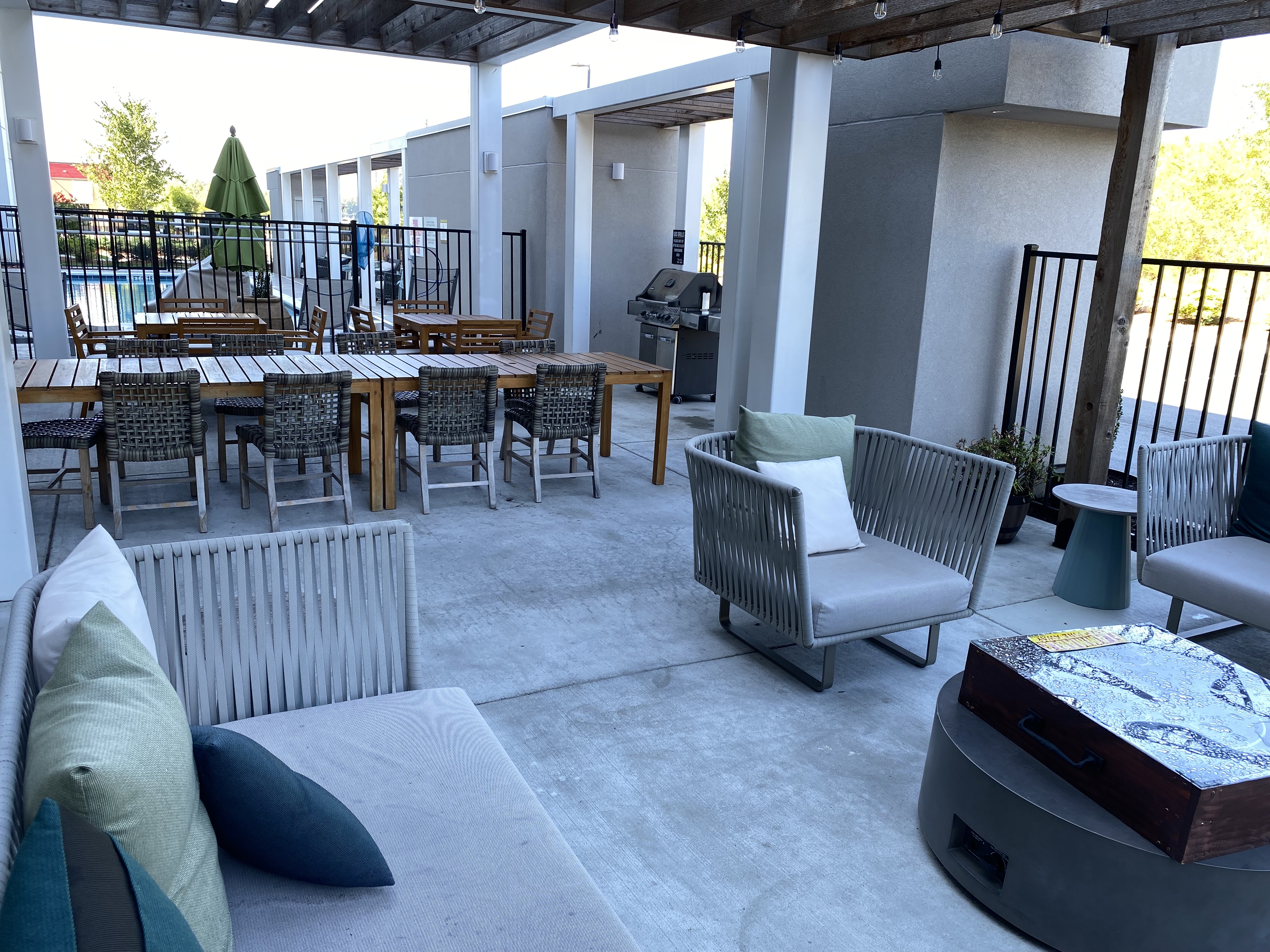 a patio with chairs and tables