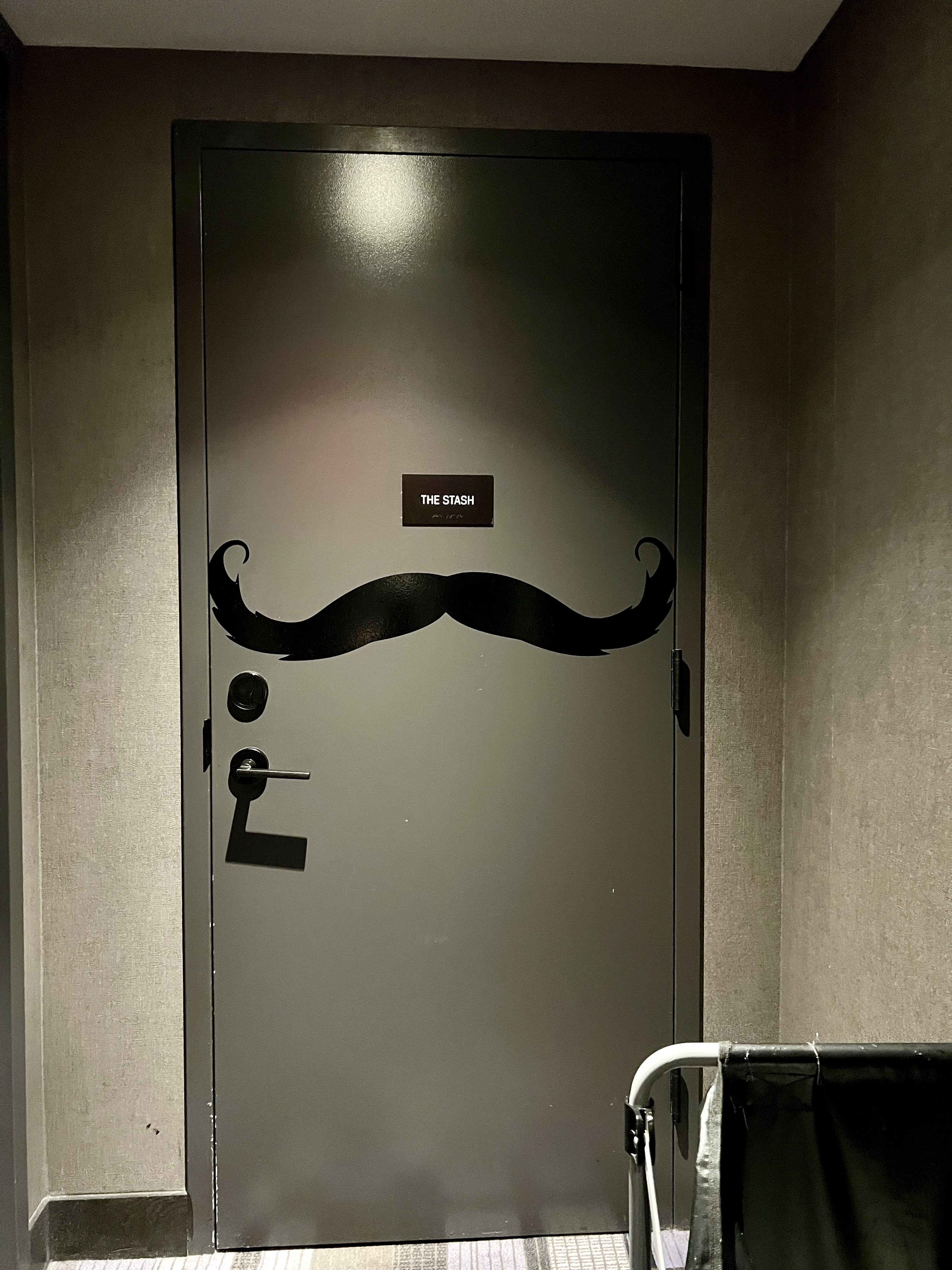 a door with a mustache painted on it