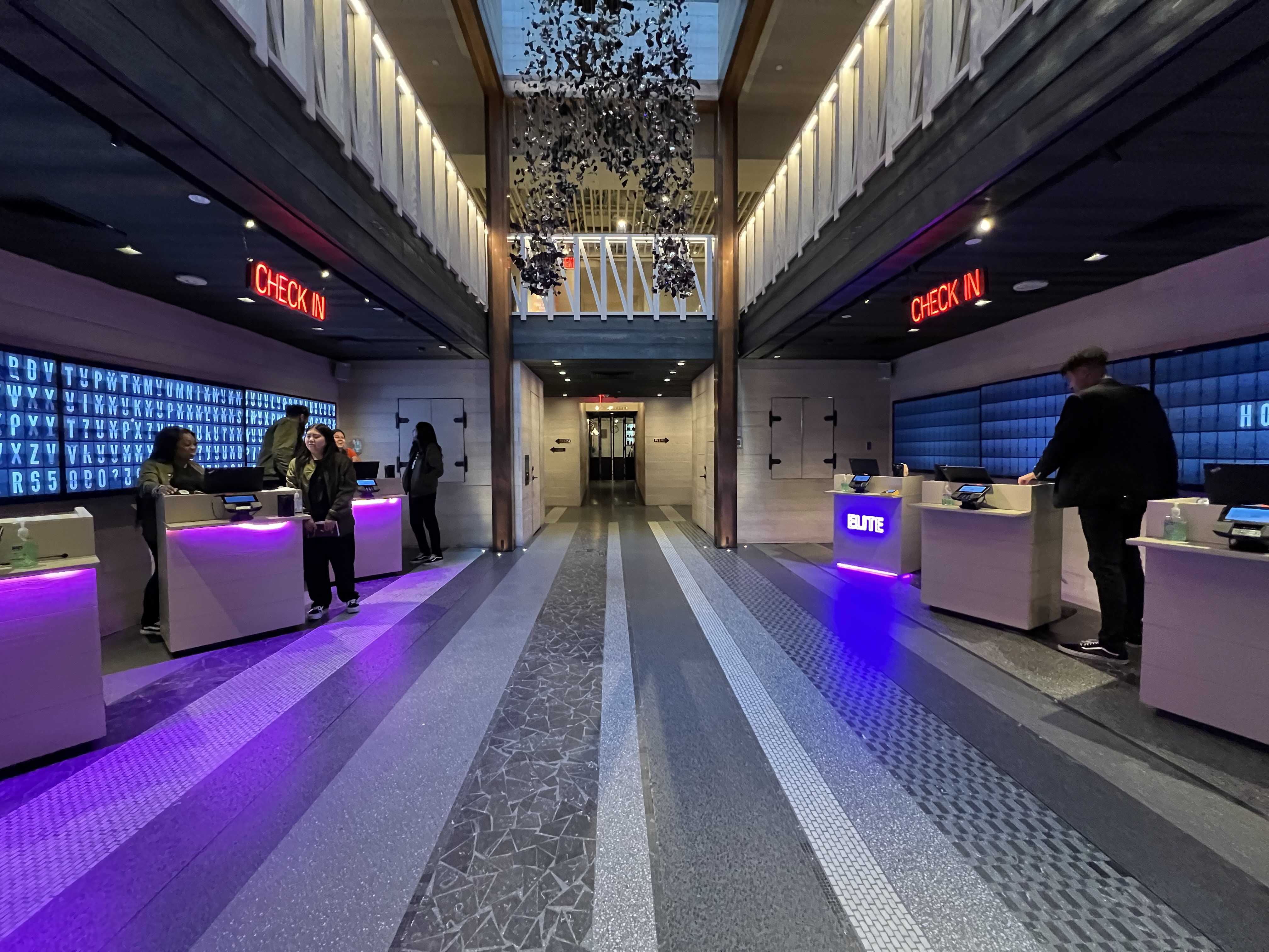 a hotel lobby with people standing in front of it