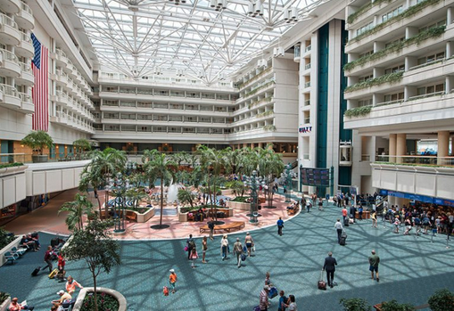 a large building with many people walking around