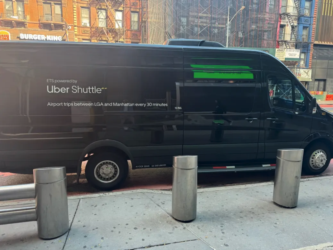 a black van parked on the side of a road