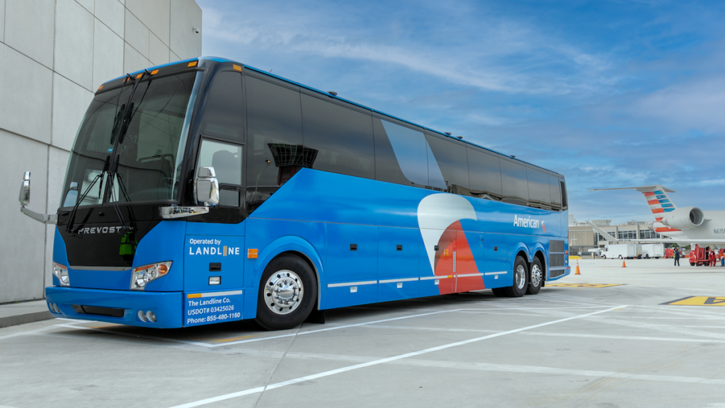 a blue bus parked in a parking lot