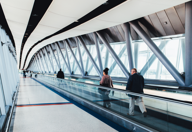 people walking on an escalator