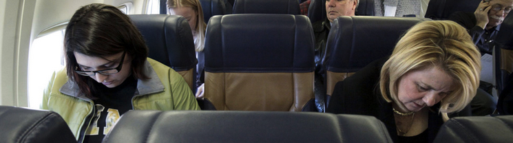 a group of people sitting on a plane