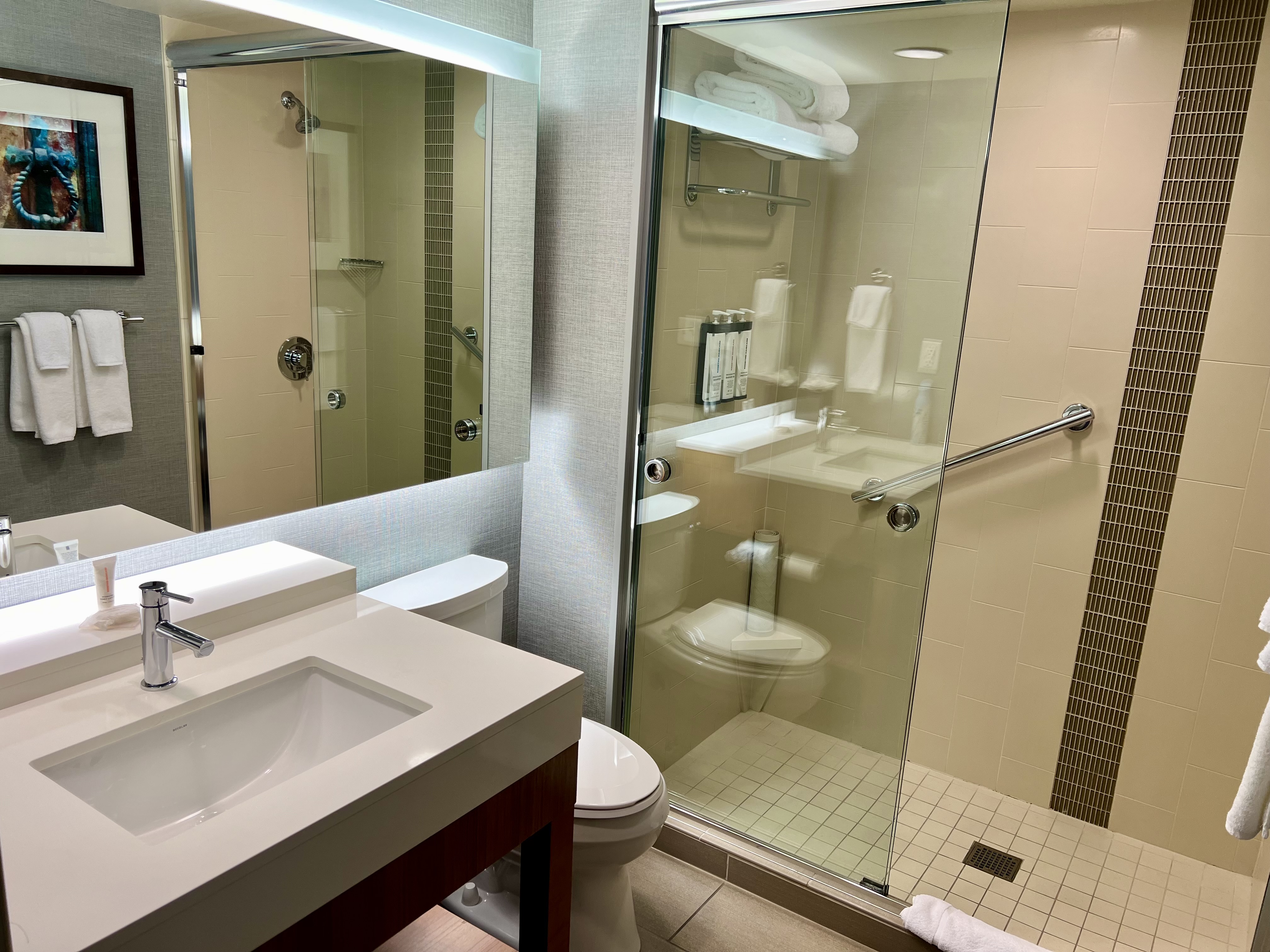 a bathroom with a glass shower door