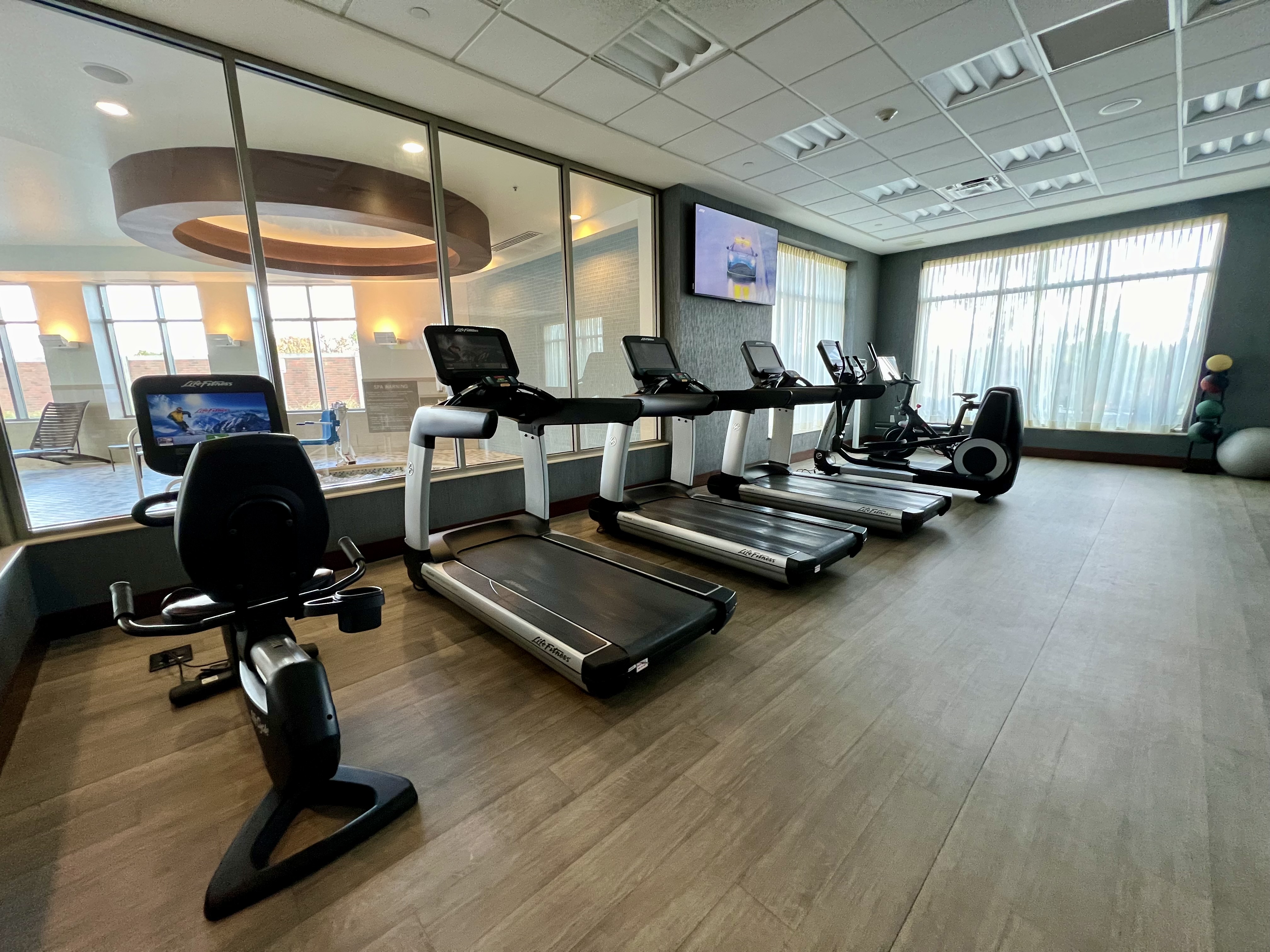 a room with treadmills and exercise machines