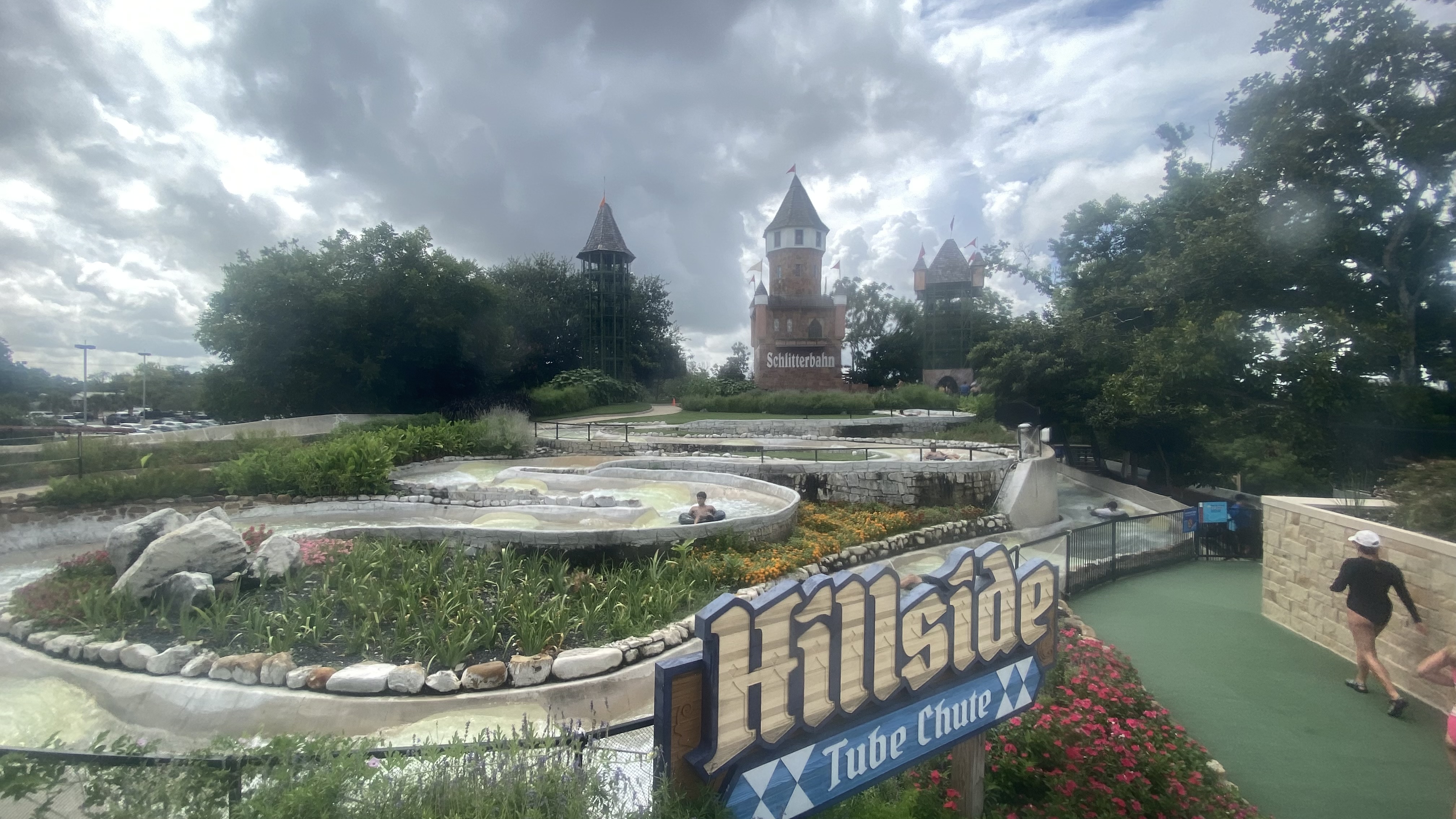 a sign with a castle in the background