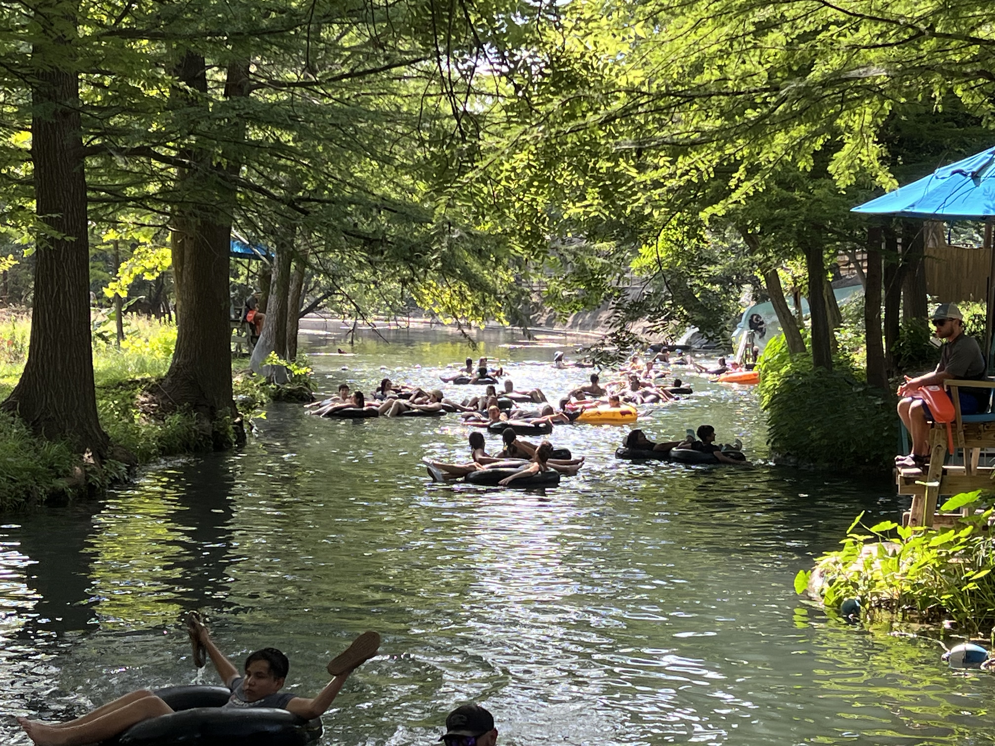 a group of people in rafts in a river