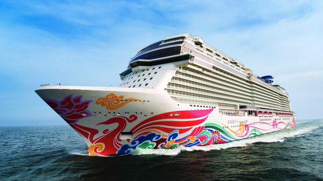 a cruise ship with colorful designs on it