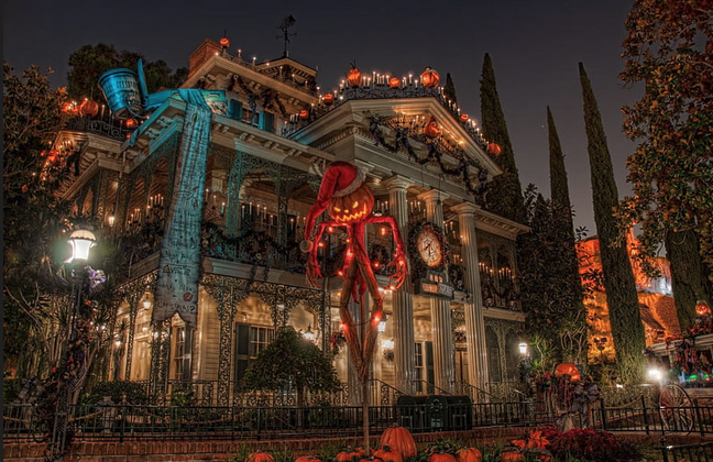 a house with a large pumpkin statue