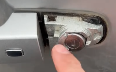 a finger pressing a lock