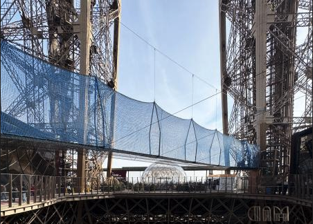 a bridge over a large metal structure