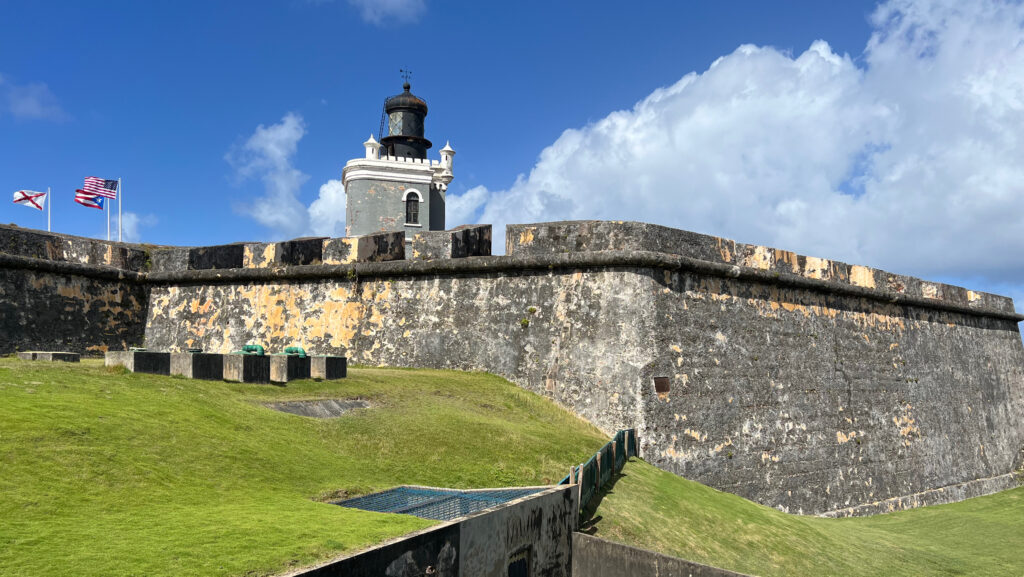 a stone wall with a tower on top of it