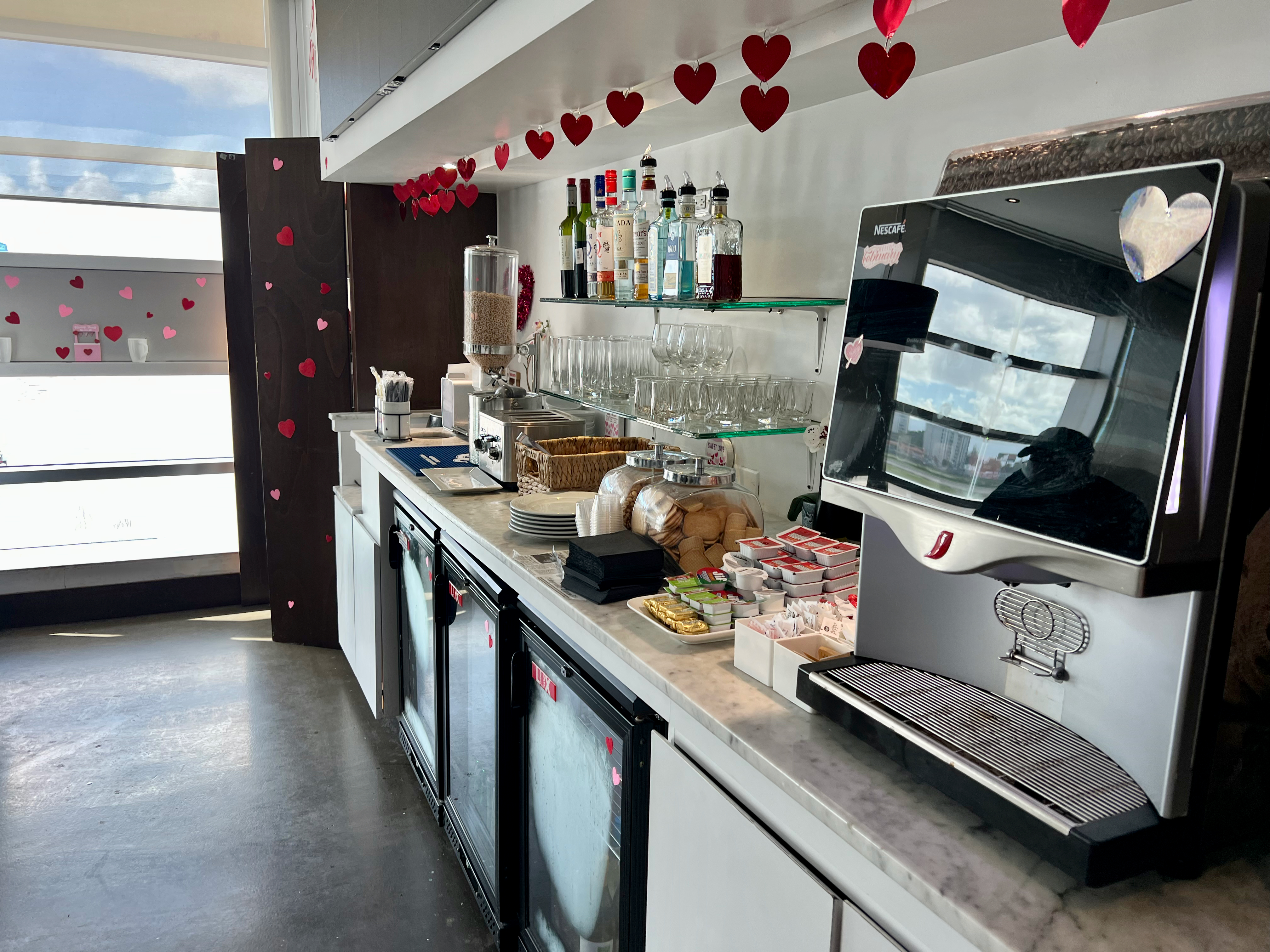 a counter with drinks and a tv