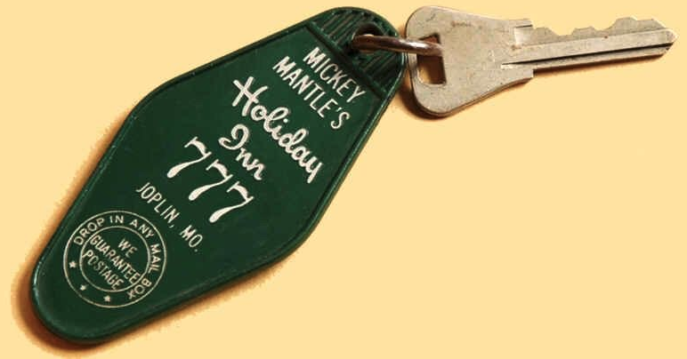 a green keychain with white text