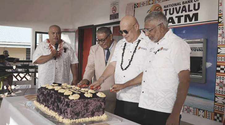 a group of men cutting a cake