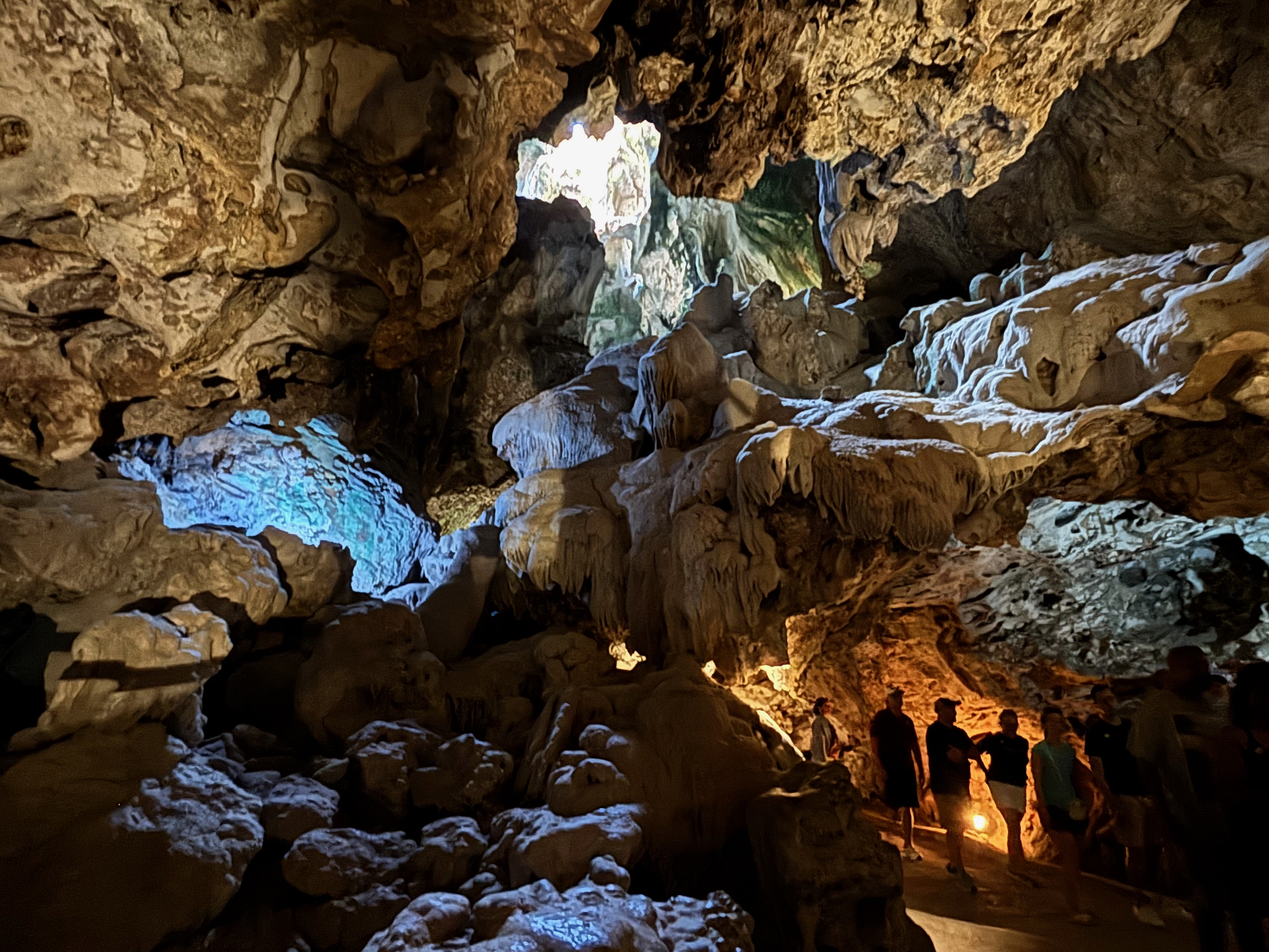 a group of people standing in a cave