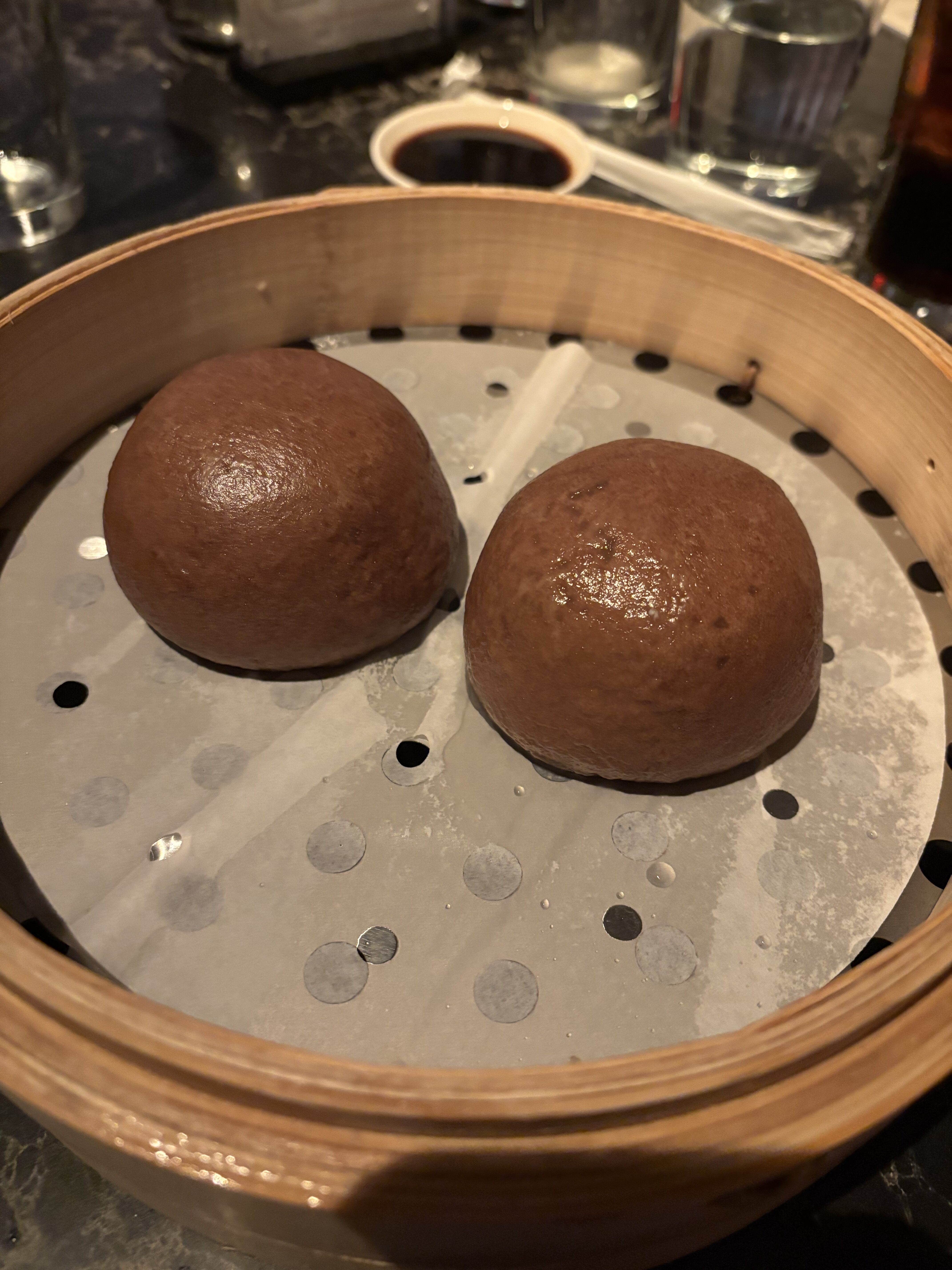 a round brown food item in a wooden basket