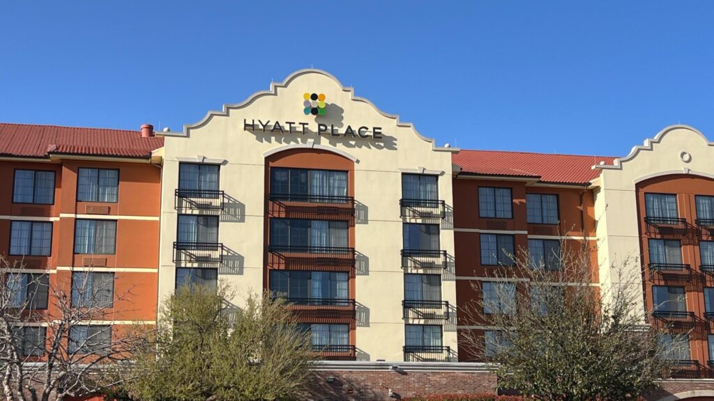 a building with balconies and a sign