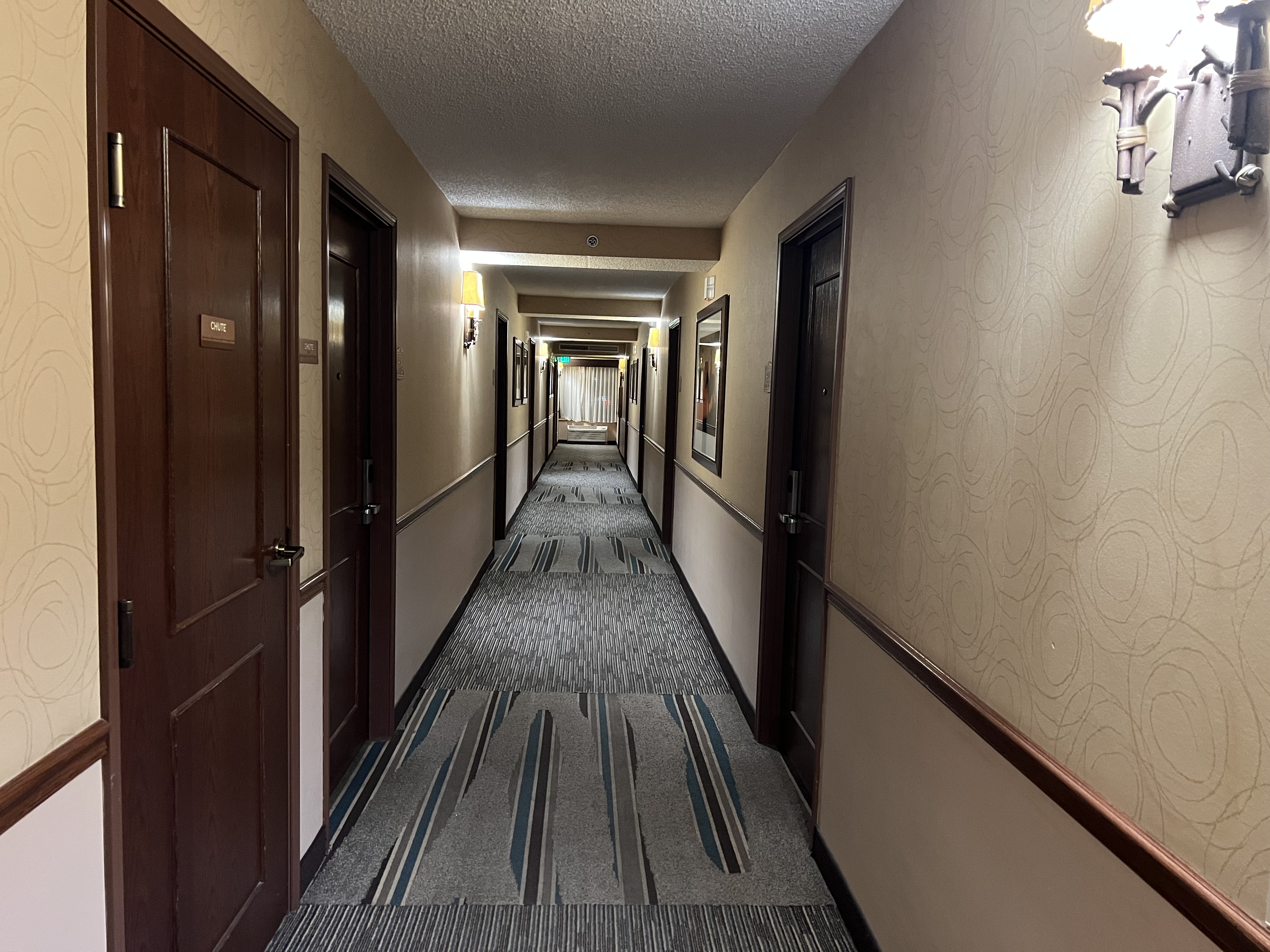 a hallway with a carpeted floor