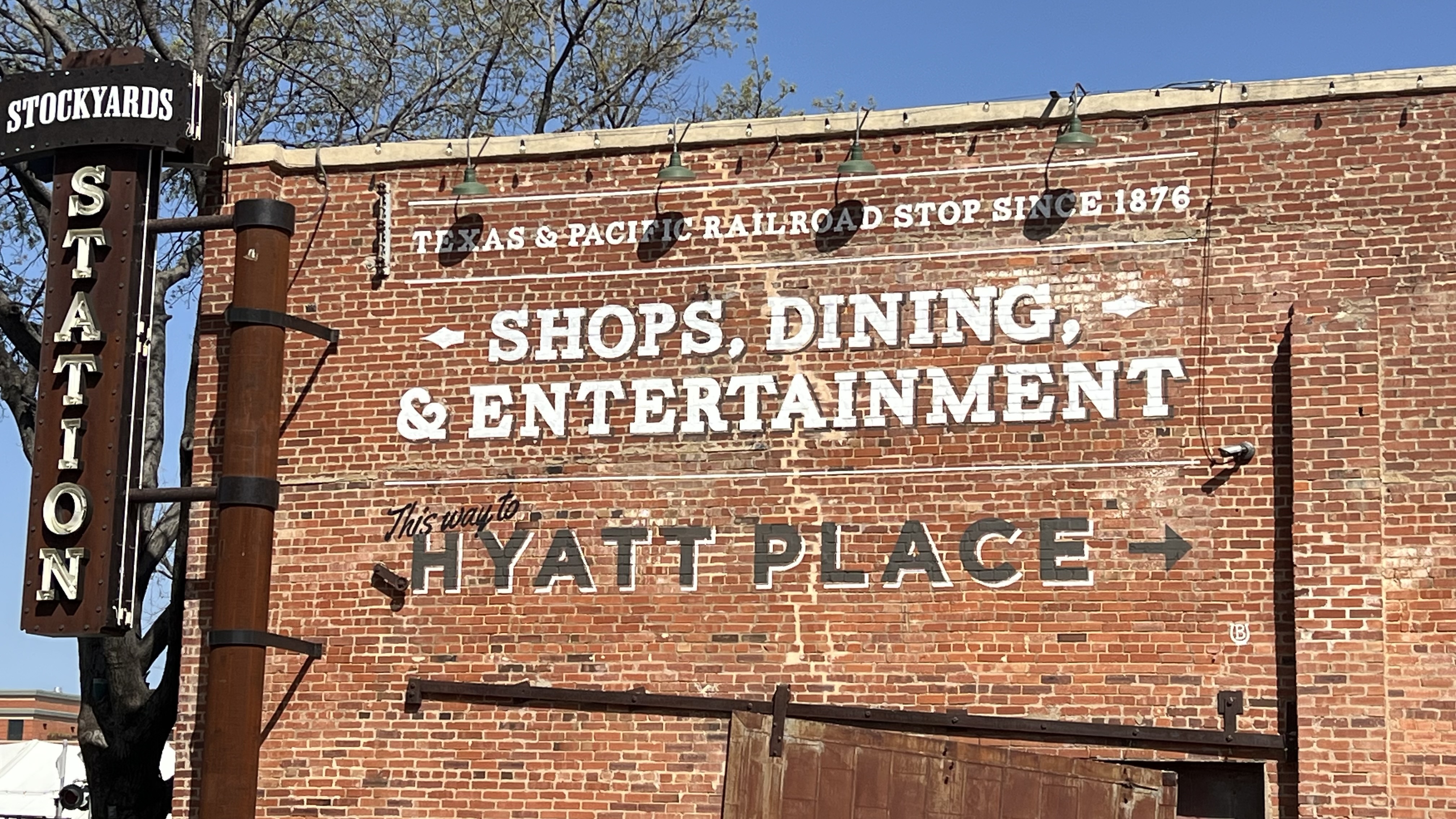 a brick building with white text on it