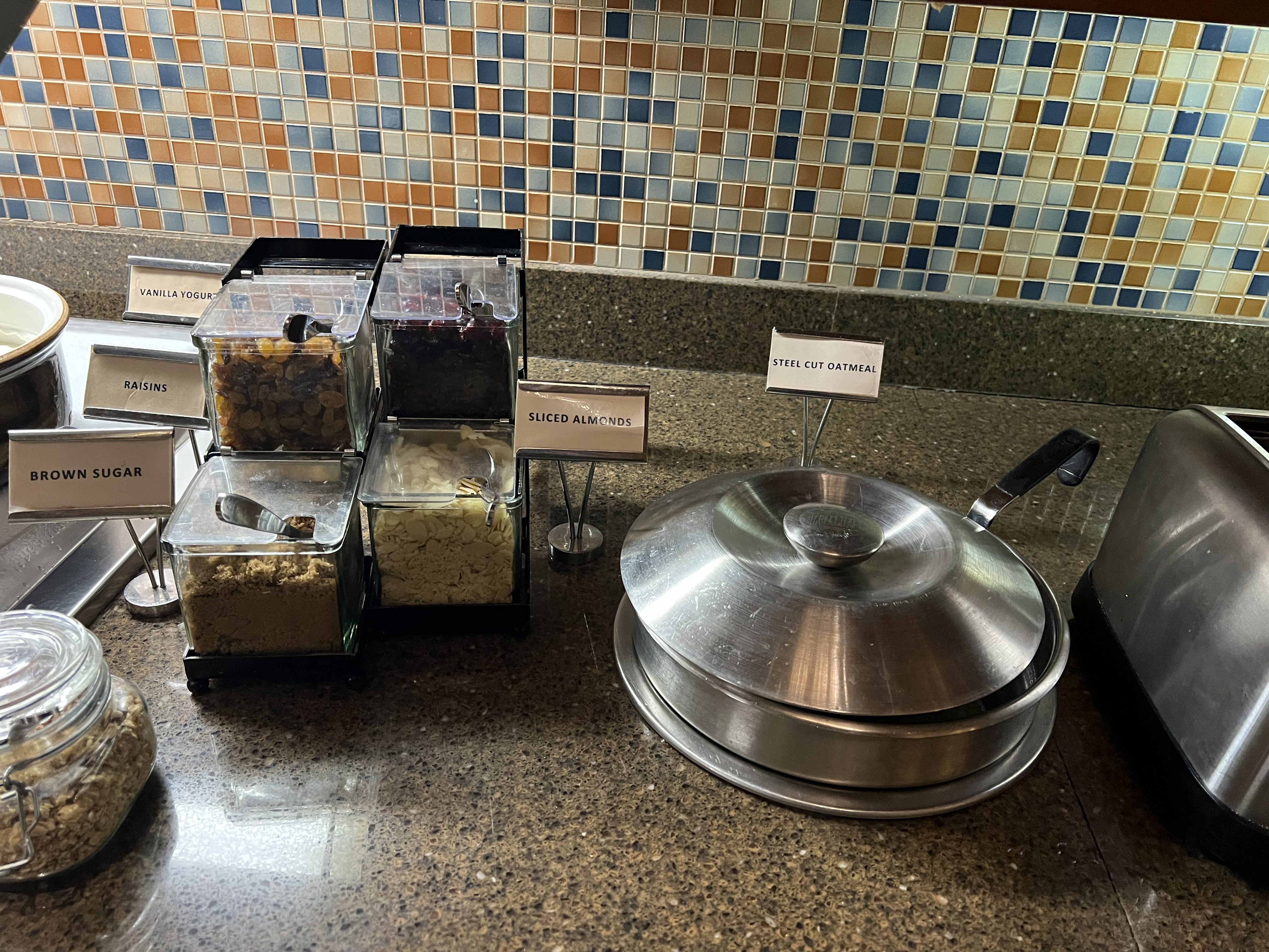 a group of containers with food on a counter