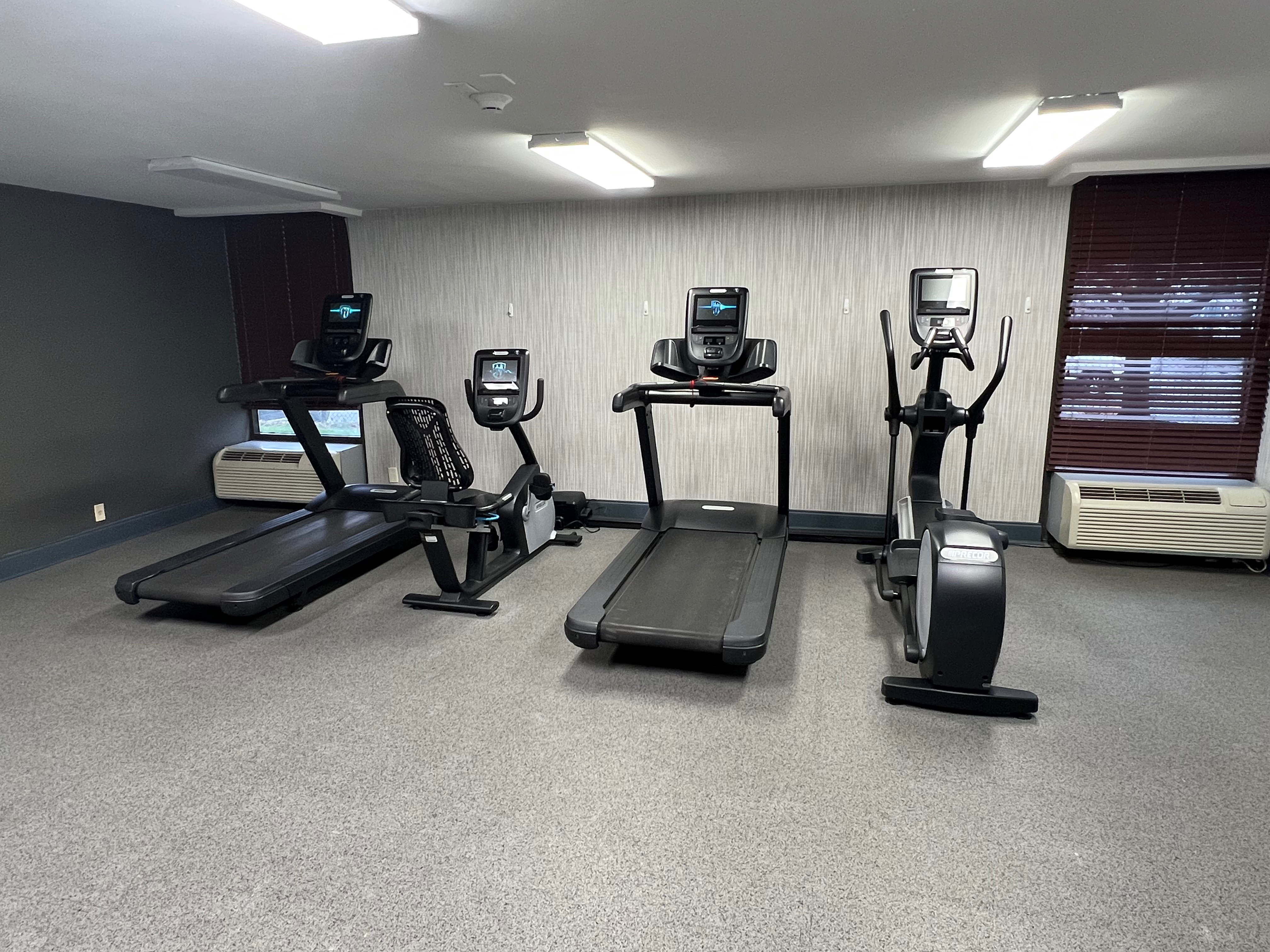 a room with treadmills and treadmills