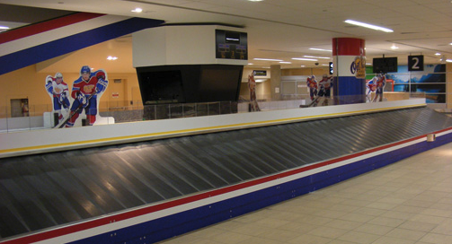 a close-up of a luggage conveyor belt