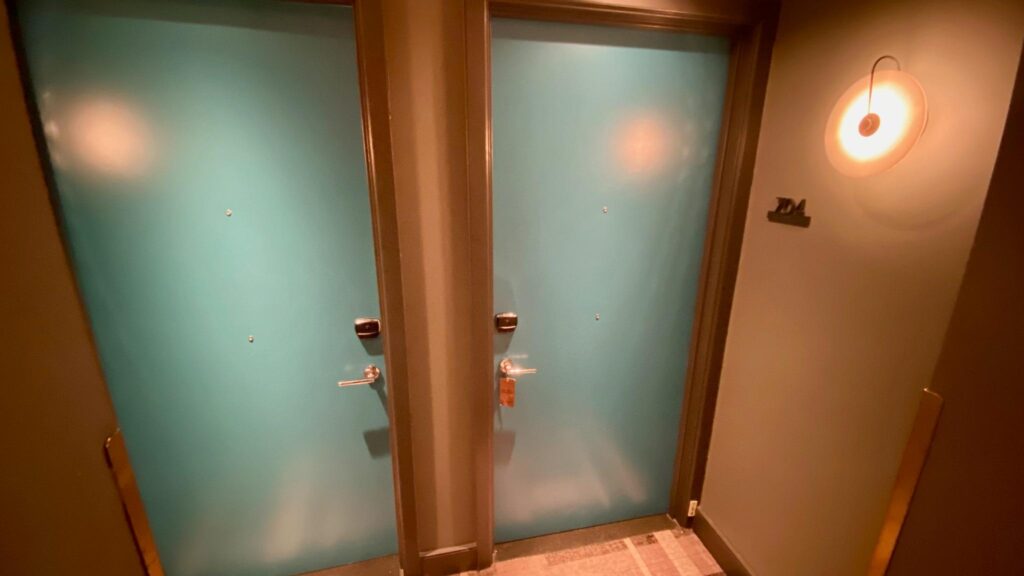 two blue doors with a door lock