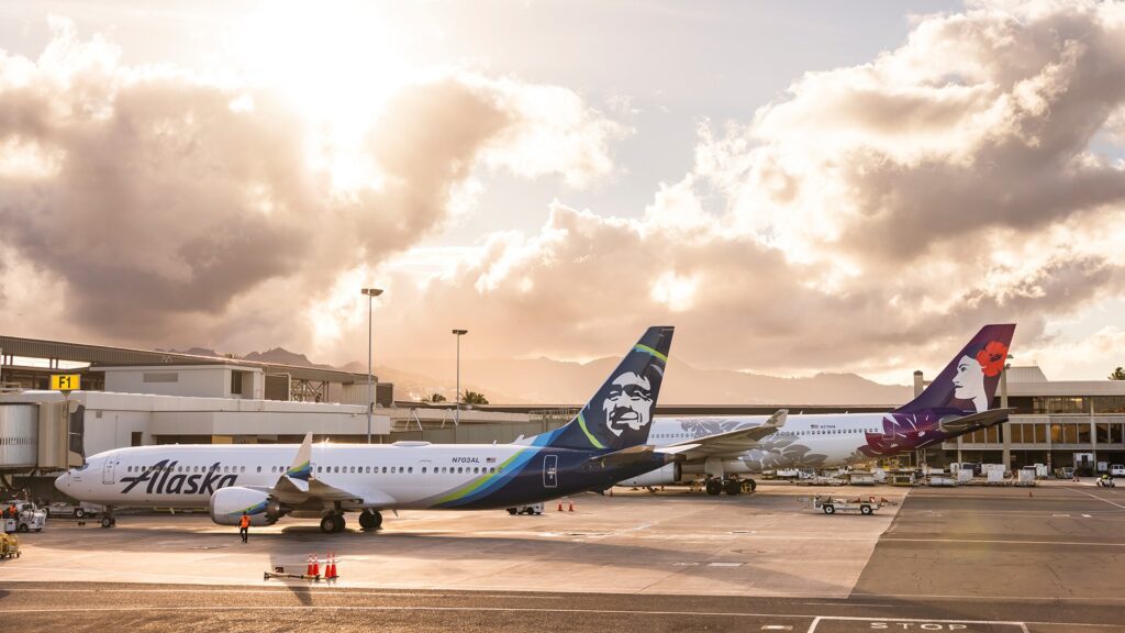 a group of airplanes at an airport