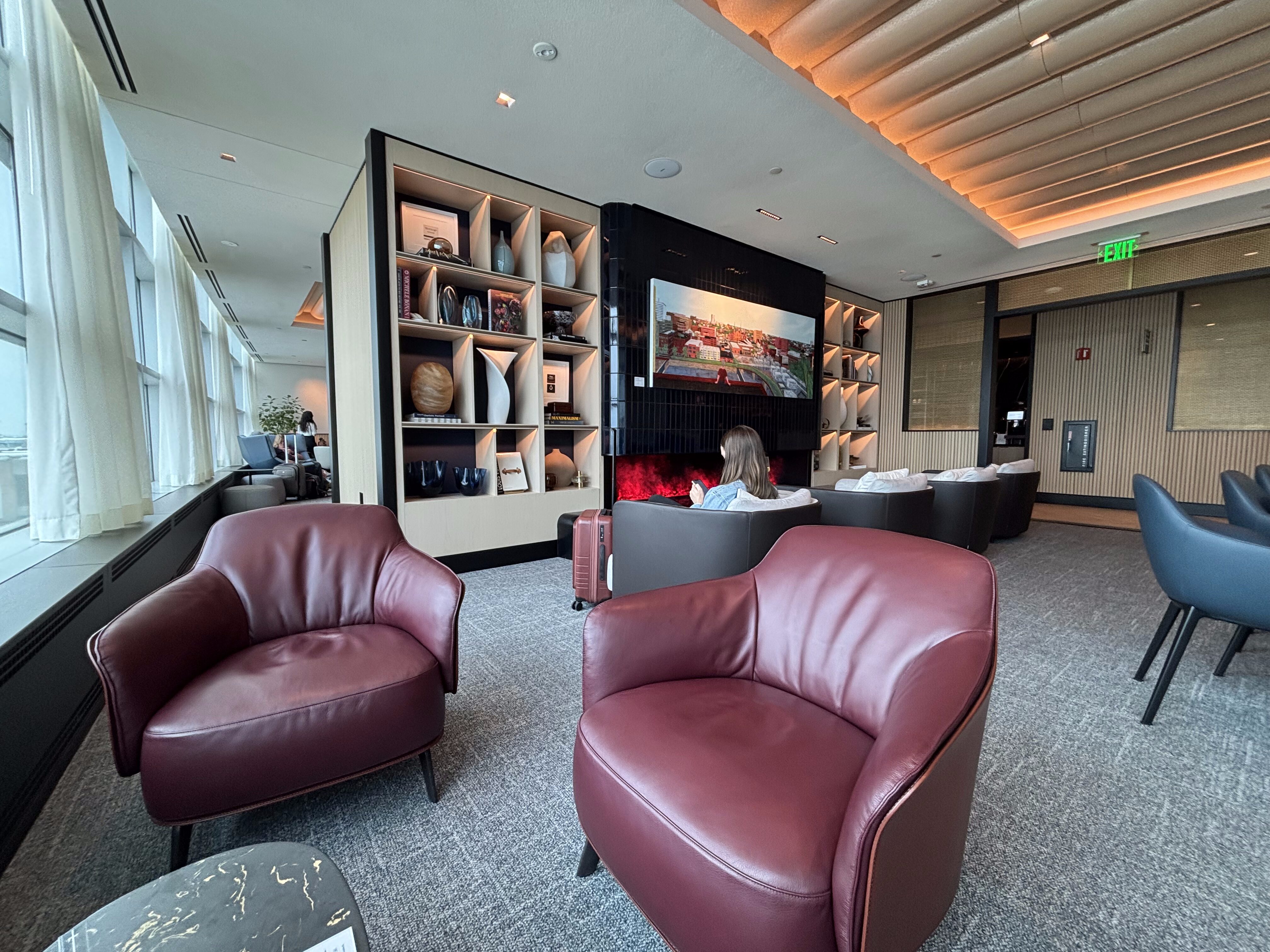 a room with chairs and a fireplace